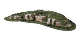Detailed miniature model of a rocky hill with green vegetation and exposed rock faces