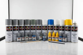 Vallejo paints spray cans and bottles arranged in a row, model hobby supplies at MPM Hobbies