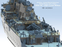 Model of a US Navy guided missile destroyer with detailed superstructure on a light blue background.
