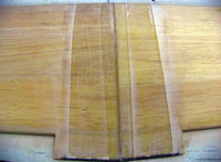 Close-up of a wooden cutting board with a natural finish