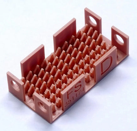 Red plastic component with 'FS' branding on a white background