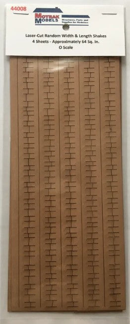 Wooden model railroad track layout template with MetraTrak Models packaging.