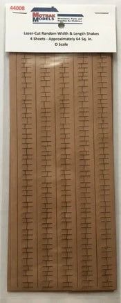 Wooden model railroad track layout template with MetraTrak Models packaging.