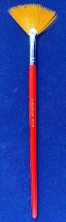Artiste brush with red handle and yellow bristles on a blue background