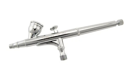 Silver airbrush gun on a white background