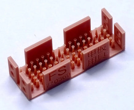 Red plastic component with 'FS' branding on a white background