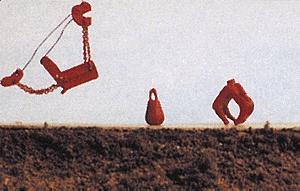 Red mechanical sculptures on a plain background