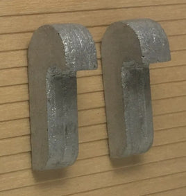 Metallic letter 'C' on a wooden background