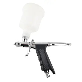 Airbrush gun with white nozzle on a white background