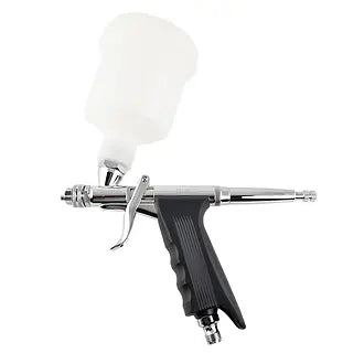 Airbrush gun with white nozzle on a white background