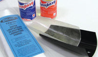Two cans of Aeropoxy resin, a roll of glass纤维 laminating fabric, and a blue label on a white surface.