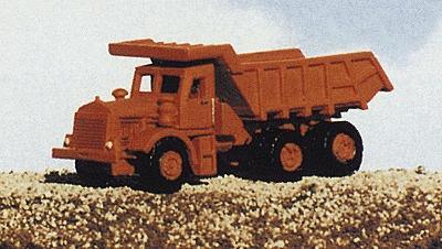 Model of a large brown dump truck on a textured surface with a light blue sky background