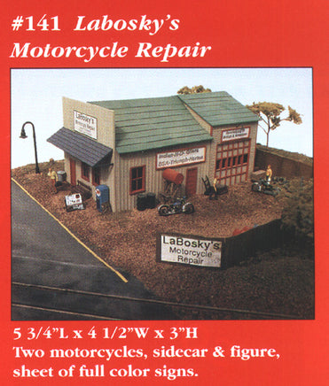Model of a motorcycle repair shop with text detailing product specifications.