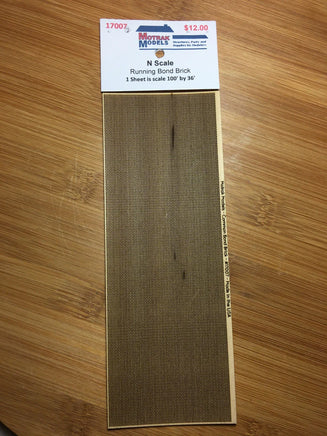 N-scale running bond brick on a wooden surface with a model train track layout component label.