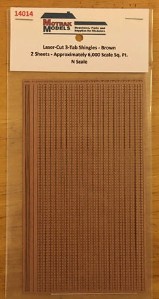 Model shingles packaging with text on a wooden surface