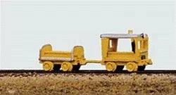 Small yellow toy train on a plain background