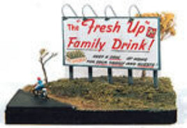 Model of a billboard with 'The Fresh Up Family Drink!' text and a small figure near it.