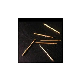 Gold-colored pins on a dark surface