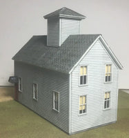 Model of a two-story building with a cupola on a plain background
