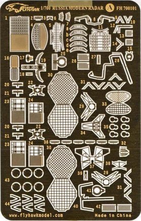 Model kit of a Russia modern radar with component parts on a brown background