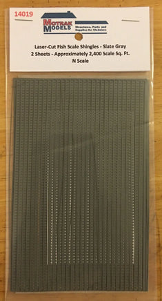 Model shingles packaging with text on a wooden surface