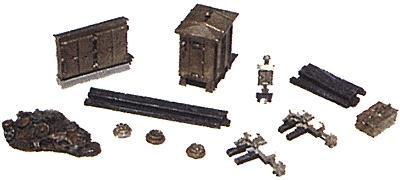 Collection of model train tracks and accessories on a white background