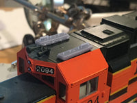 Close-up of a model train engine with '2094' on a blurred background