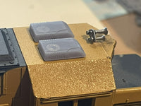Two transparent containers on a textured surface with a blurred background