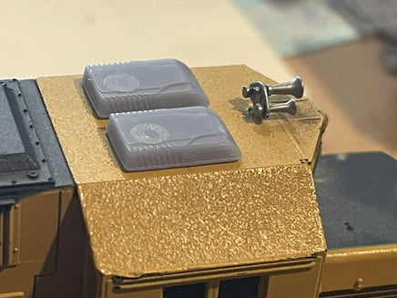 Two transparent containers on a textured surface with a blurred background