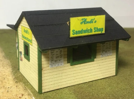 Model of a sandwich shop with 'Andi's' branding on a plain background