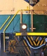 Close-up of a train engine with visible branding