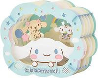 Cinnamoroll plush toy with a pastel-colored design featuring other characters.
