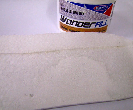Can of Wonderfill foam and wood filler on a white surface