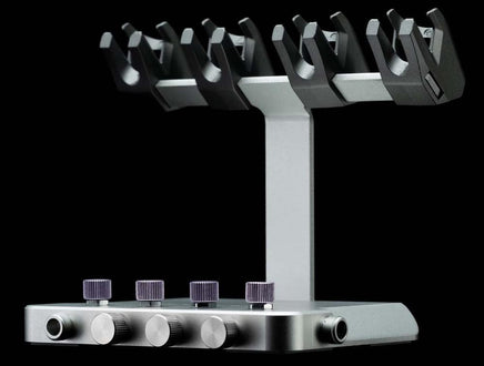 Metal stand with multiple arms and adjustable knobs on a black background