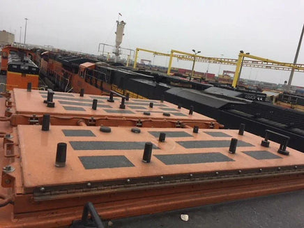 Container deck with cargo on a ship in a port setting