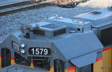 Close-up of a train engine number 1579 on railway tracks.