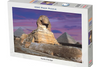 Jigsaw puzzle box featuring the Sphinx and pyramids with a purple sky.