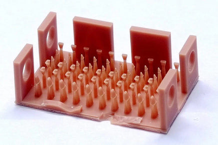 3D-printed dental model with multiple components on a white background