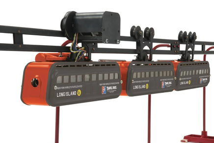 Model train set with three cars on a track, featuring 'Long Island' branding.