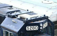 Close-up of a vehicle with license plates '5280' and '6280'.
