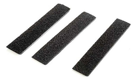 Three black foam strips on a white background