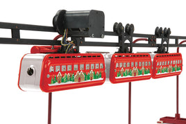 Model train set with red passenger cars on a track against a white background
