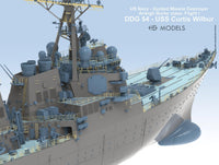 Model of a US Navy guided missile destroyer on a light blue background