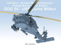 Model of a US Navy guided missile destroyer with helicopter on a blue background