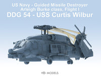 Model of a US Navy guided missile destroyer with text indicating it is a DDG 54 USS Curtis Wilbur.