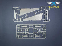 Model kit components with X-SCALE logo on a dark blue background