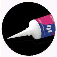 White glue tube with a colorful label on a black background