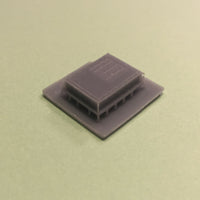 Gray rectangular object on a beige background