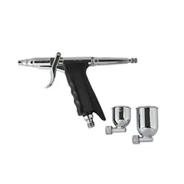 Airbrush gun with two nozzles on a white background