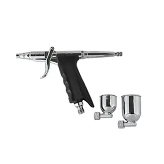 Airbrush gun with two nozzles on a white background